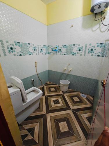 a bathroom with a sink and a toilet in it at SAlBALA LODGE - AC ROOMS WITH COOKING FACILITIES Near CMC in Vellore