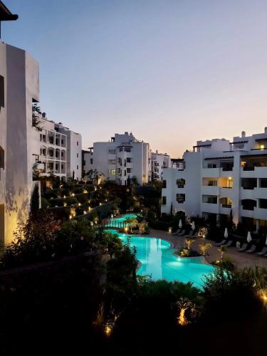 a view of a pool in a city with buildings at Modern Oasis with Jacuzzi & Two Terraces in Palm-Mar