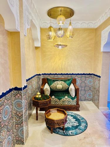 a living room with a couch and a table at Riad le marin Coucou beach in Agadir