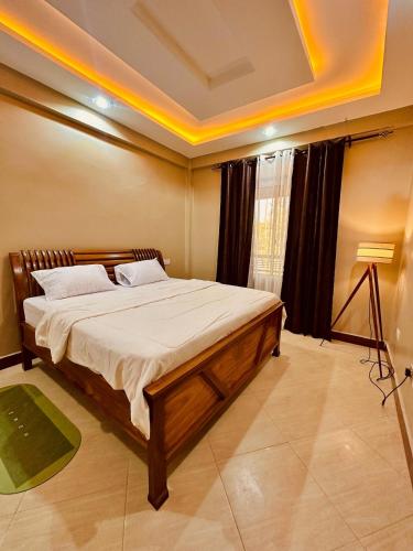 Postel nebo postele na pokoji v ubytování Nyumbani Deluxe in Kijitonyama