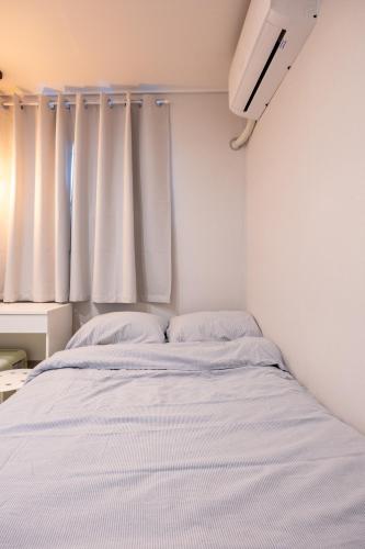Letto o letti in una camera di GreeneStay Sindang DDP Seoul