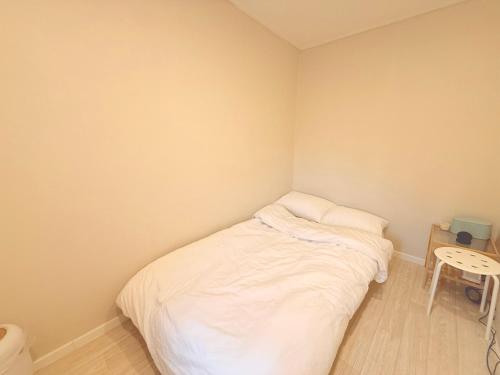 Letto o letti in una camera di GreeneStay Sindang DDP Seoul