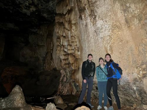 a group of people standing in a cave at Auberge & Restaurant Agoudal in Agoudal
