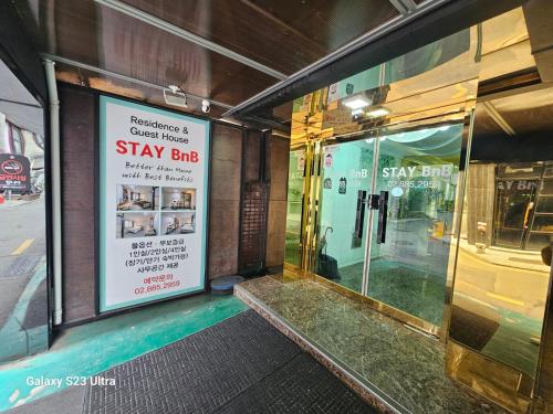 a store front with a sign for a stay shop at stay bnb 206 in Seoul