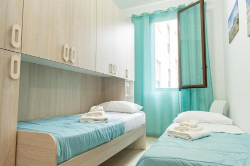 Postel nebo postele na pokoji v ubytování Sale di Sicilia Apartment