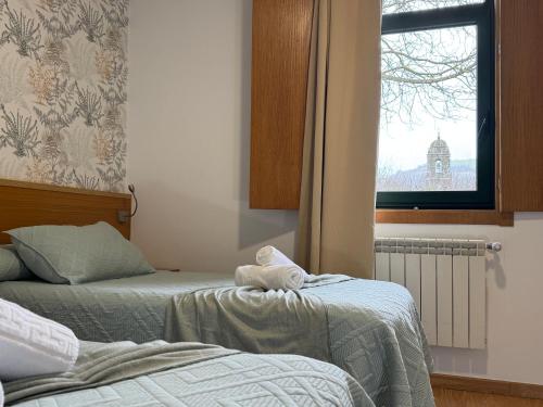 Una cama o camas en una habitación de Complexo Xacobeo