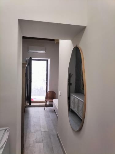 a hallway with a mirror on a wall at Il Casalino di Mary in Pizzo