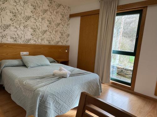 Una cama o camas en una habitación de Complexo Xacobeo