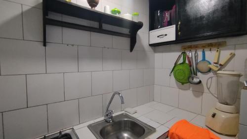 a kitchen with a sink and a counter top at GiGi House 2 in Taganga