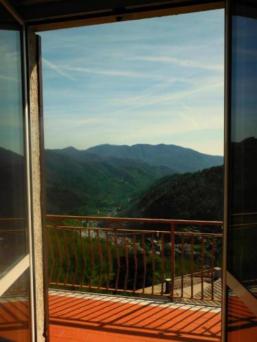 a view of the mountains from a window at Caregli Countryhouse in Borzonasca