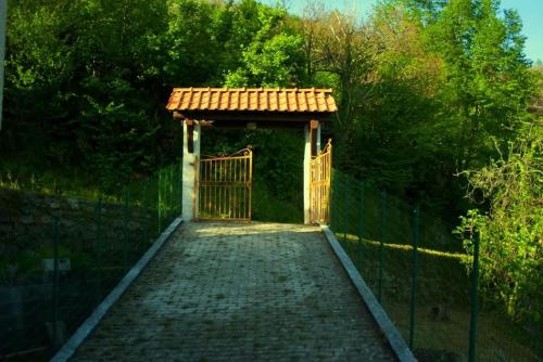 an entrance to a gate with a fence at Caregli Countryhouse in Borzonasca