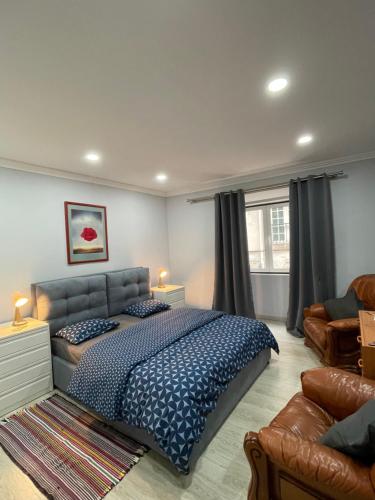a bedroom with a bed and a couch at Sony Apartments in Lisbon