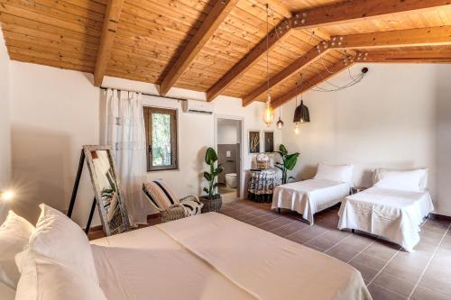 Postel nebo postele na pokoji v ubytování Casale Giancesare Villa Agricola