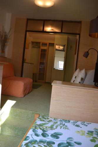 a hotel room with a bed and a couch at Pension U akátu in Prague