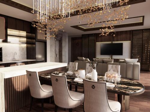 a dining room with a chandelier and a table and chairs at Sanggraloka Ubud in Ubud