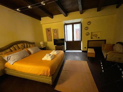 a bedroom with a bed and a living room at Domus Telesio Bed & Breakfast in Cosenza