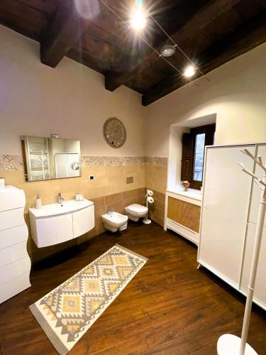 a bathroom with two toilets and a sink at Domus Telesio Bed & Breakfast in Cosenza
