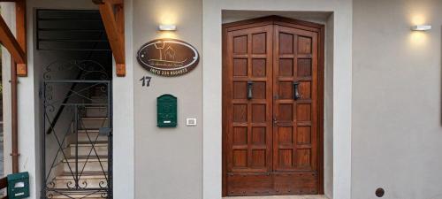 a door to a building with a sign on it at B&B La Locanda del Sorriso in Orte