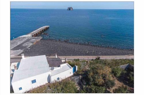 an aerial view of a house and the ocean at La casa del vecchio molo in Stromboli