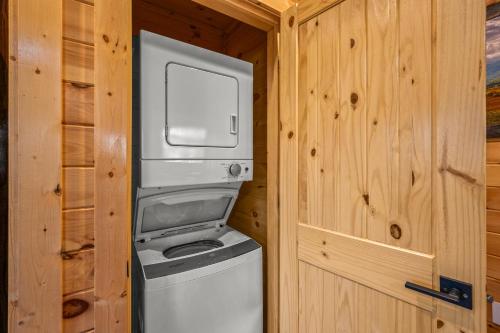 a washer and dryer in a tiny house at Big Bear Bend Gatlinburg Chalet Village in Gatlinburg