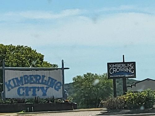 a couple of signs on the side of a road at Swan's Getaway Lakeview Condo in Kimberling City