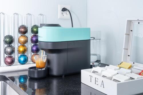 a blender sitting on a kitchen counter with christmas decorations at Studio Apartment - Central - Kitchen - self check in in Basel