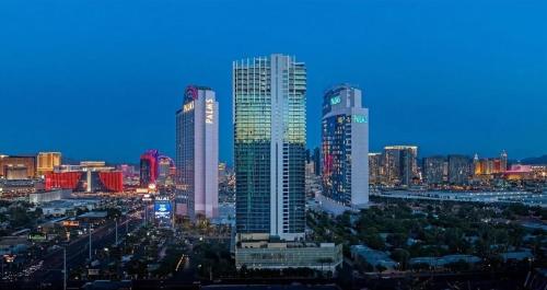 a city skyline with tall buildings at night at Palms Place- Strip View- High floor- Free parking in Las Vegas
