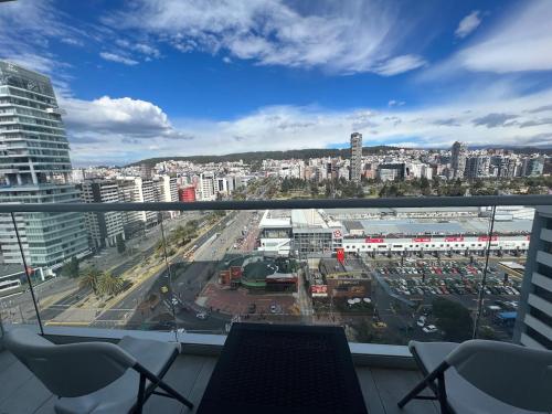 a view of a city from a balcony at Lovely View Studio Building Heated Pool Gym Turco WIFI in Quito