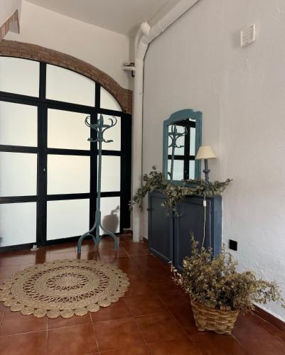 a room with a large window and a table with a lamp at Apartamento Casa Nela in Medellín