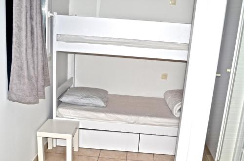 Ένα ή περισσότερα κρεβάτια σε δωμάτιο στο Appartements front de Mer SABLES D'OLONNE