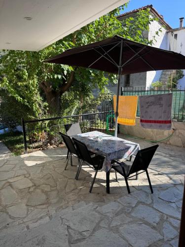 Stone house under a rock Kukos