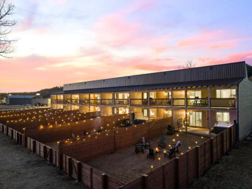 a building with a lot of lights in front of it at Fireside Grove- Downtown Stay with Hot Tub in Custer