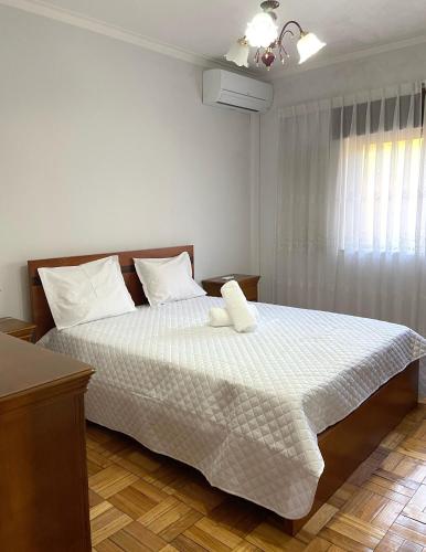 a bedroom with a bed with two pillows on it at Casa do Tojal in Fiscal
