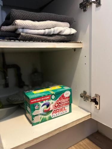 a box of oreos sitting on a shelf in a closet at Pabay View in Breakish