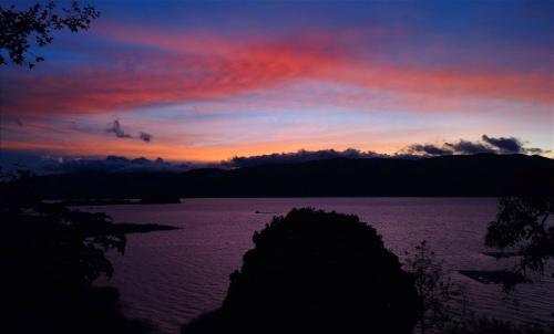a sunset over a large body of water at Cabaña Bella Vista in Pasto