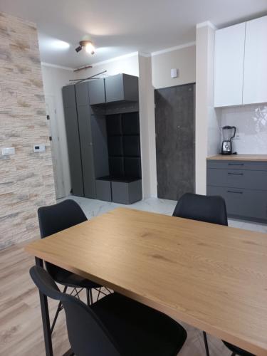 Kuchyň nebo kuchyňský kout v ubytování Apartament ósemka