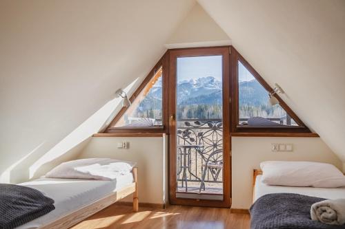 Posteľ alebo postele v izbe v ubytovaní Tatry Panorama