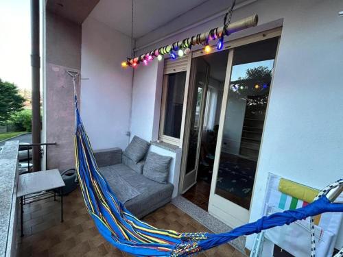 a hammock on the side of a house at Rocci di Fontana by K-rol in Alba