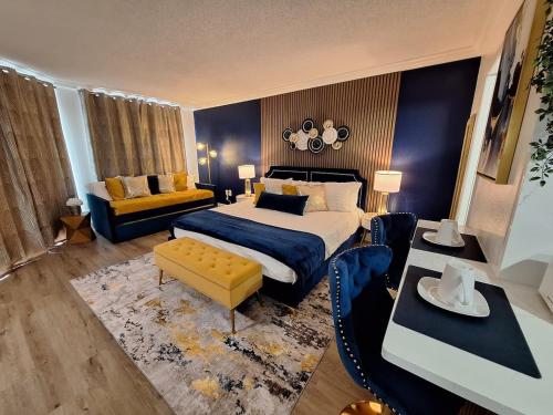 a bedroom with a king sized bed and a couch at Luxury Lakeview Getaway 1 mile Universal Studios in Orlando