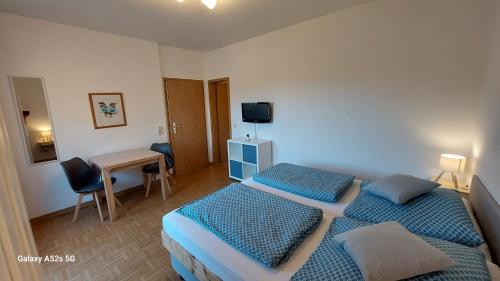 TV a/nebo společenská místnost v ubytování Gästehaus Bergwald