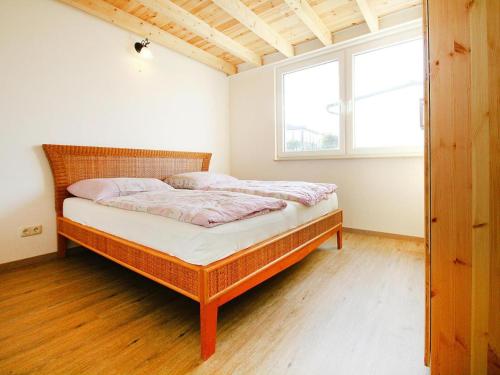 Ένα ή περισσότερα κρεβάτια σε δωμάτιο στο Ferienhaus Seeblick, Fürstenwerder