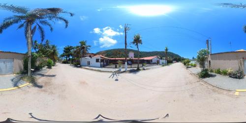 a skateboard ramp on a beach with palm trees at Canto das Laranjeiras Vista Way in Guarujá