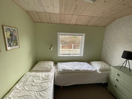 Postel nebo postele na pokoji v ubytování Autentisk sommerhus på Lakolk, Rømø
