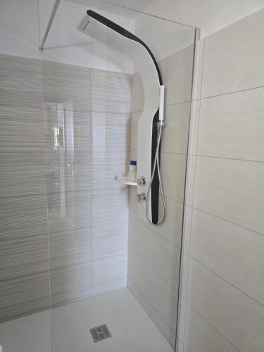 a shower with a shower head in a bathroom at Balcón de Puerto Naos in Los Llanos de Aridane