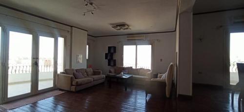 a living room with a couch and a table at Aqua Maadi Degla Group 199 in Cairo