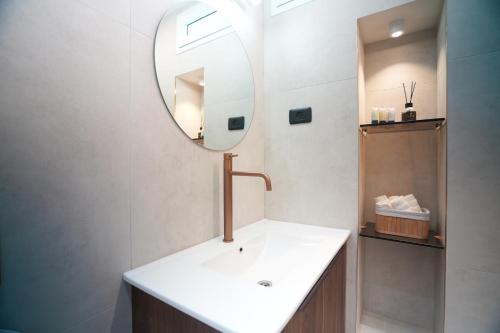 a bathroom with a sink and a mirror at onyx in Eilat