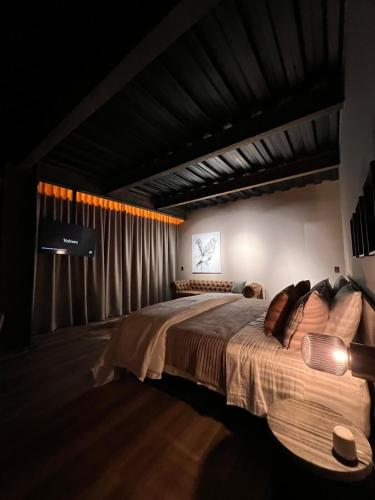 a bedroom with a large bed in a room at 1 Relax, luxury room, everything you need in Salento