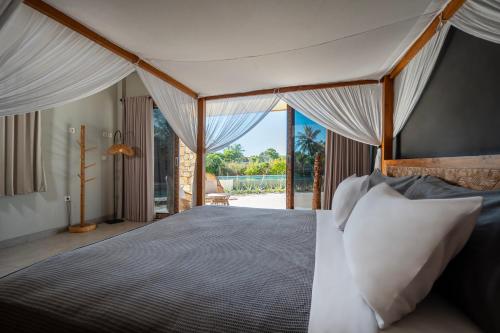 Postel nebo postele na pokoji v ubytování Manduna Resort