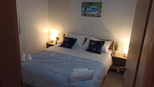 Postel nebo postele na pokoji v ubytování Holiday House Sea Laguna