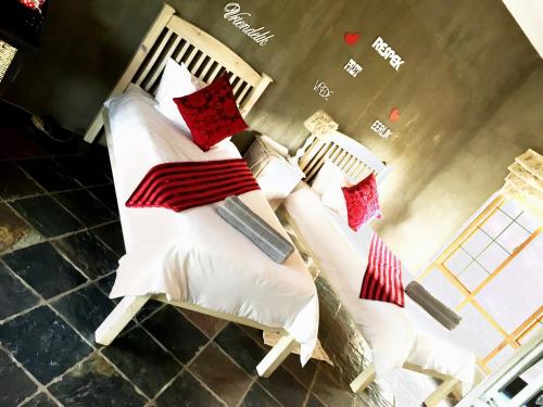 Ένα ή περισσότερα κρεβάτια σε δωμάτιο στο Hadida Guesthouse